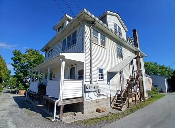 a front view of a house with garage