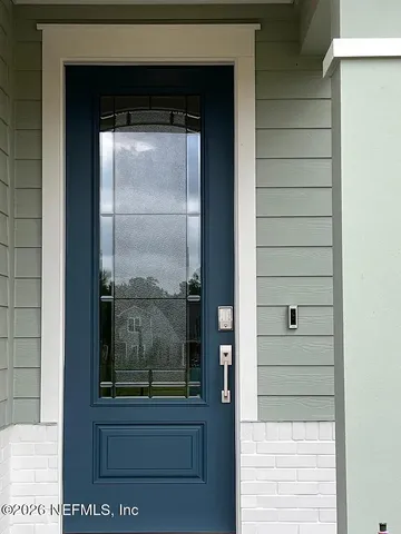 a view of a glass door of the house