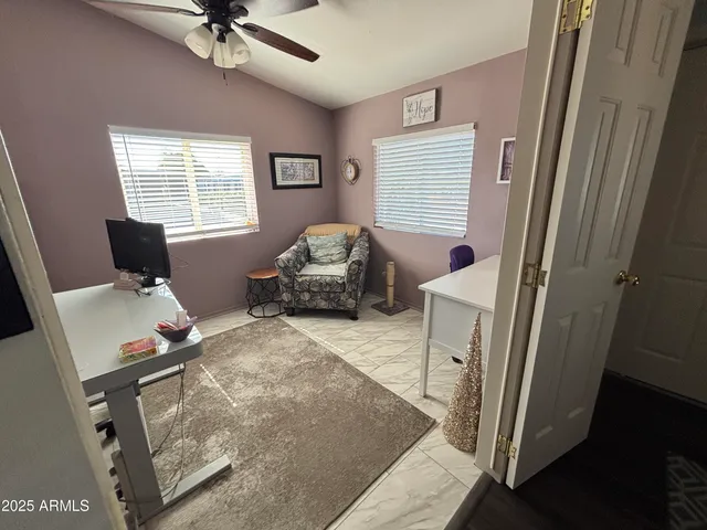 a bedroom with furniture and a window