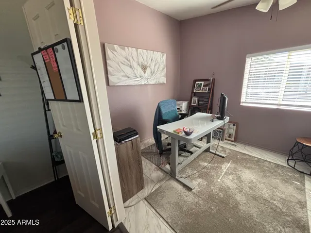 a living room with furniture and a window