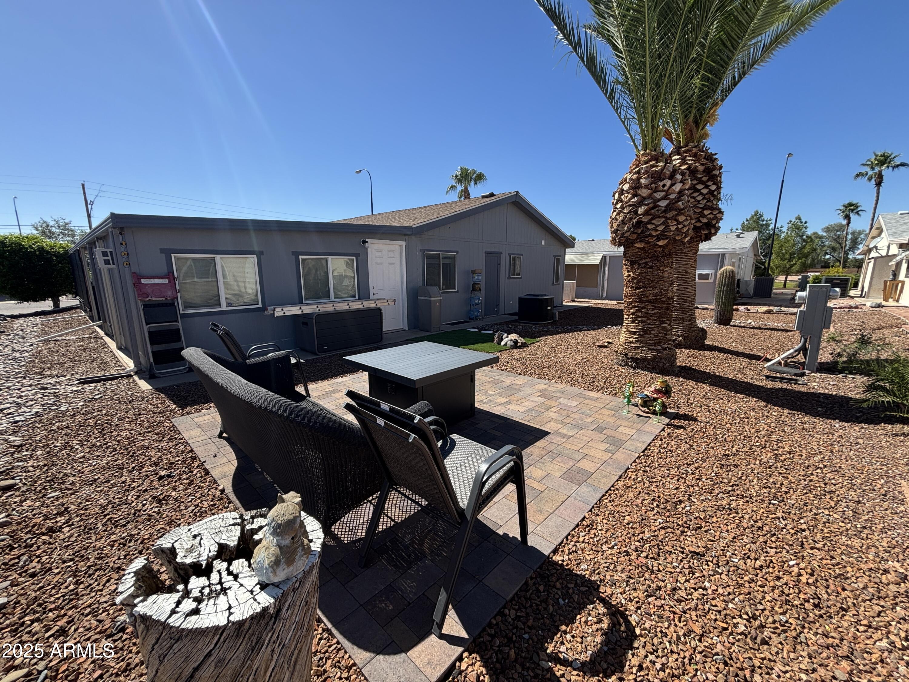 2400 East Baseline Avenue, Unit 80 Apache Junction, AZ 85119 - Photo 28 of 33 a front view of a house with garden