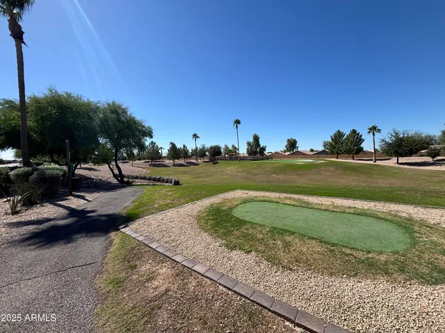 a view of a golf course with a lake