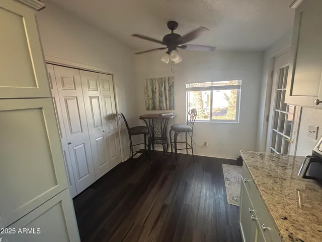 a view of a livingroom with wooden floor and a window