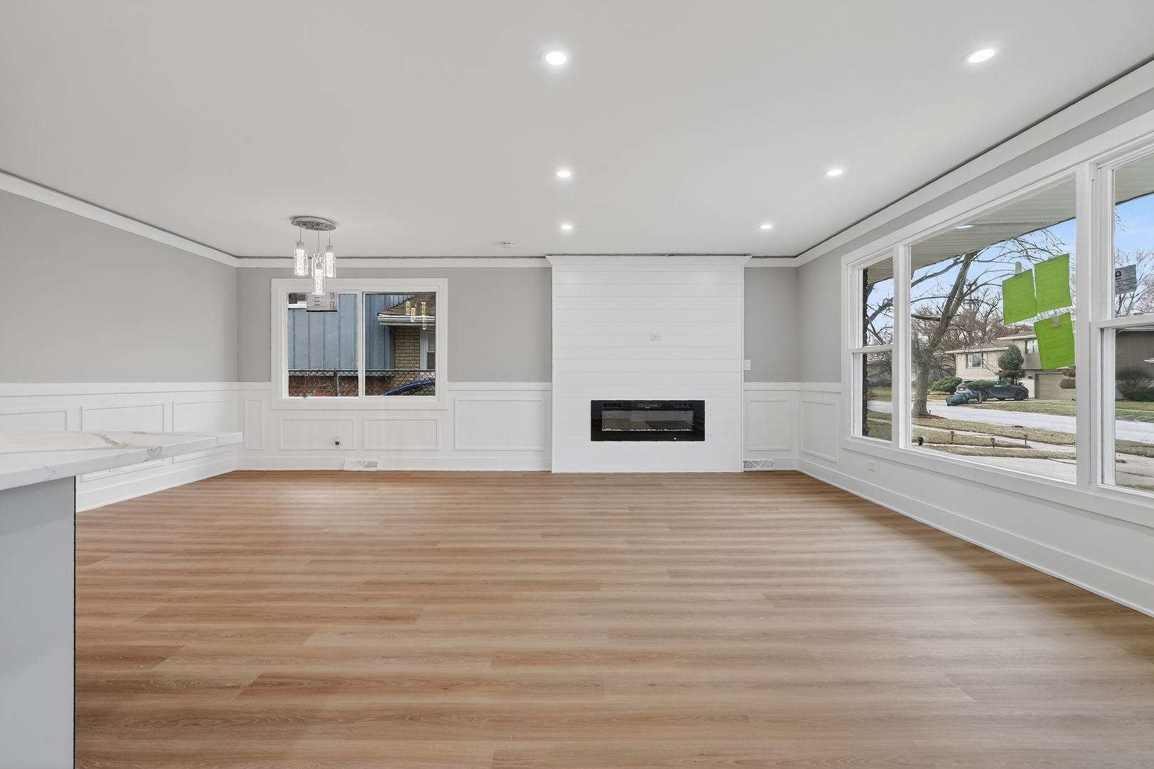 515 West 146th Street Dolton, IL 60419 - Photo 12 of 47 a view of an empty room with a window and wooden floor