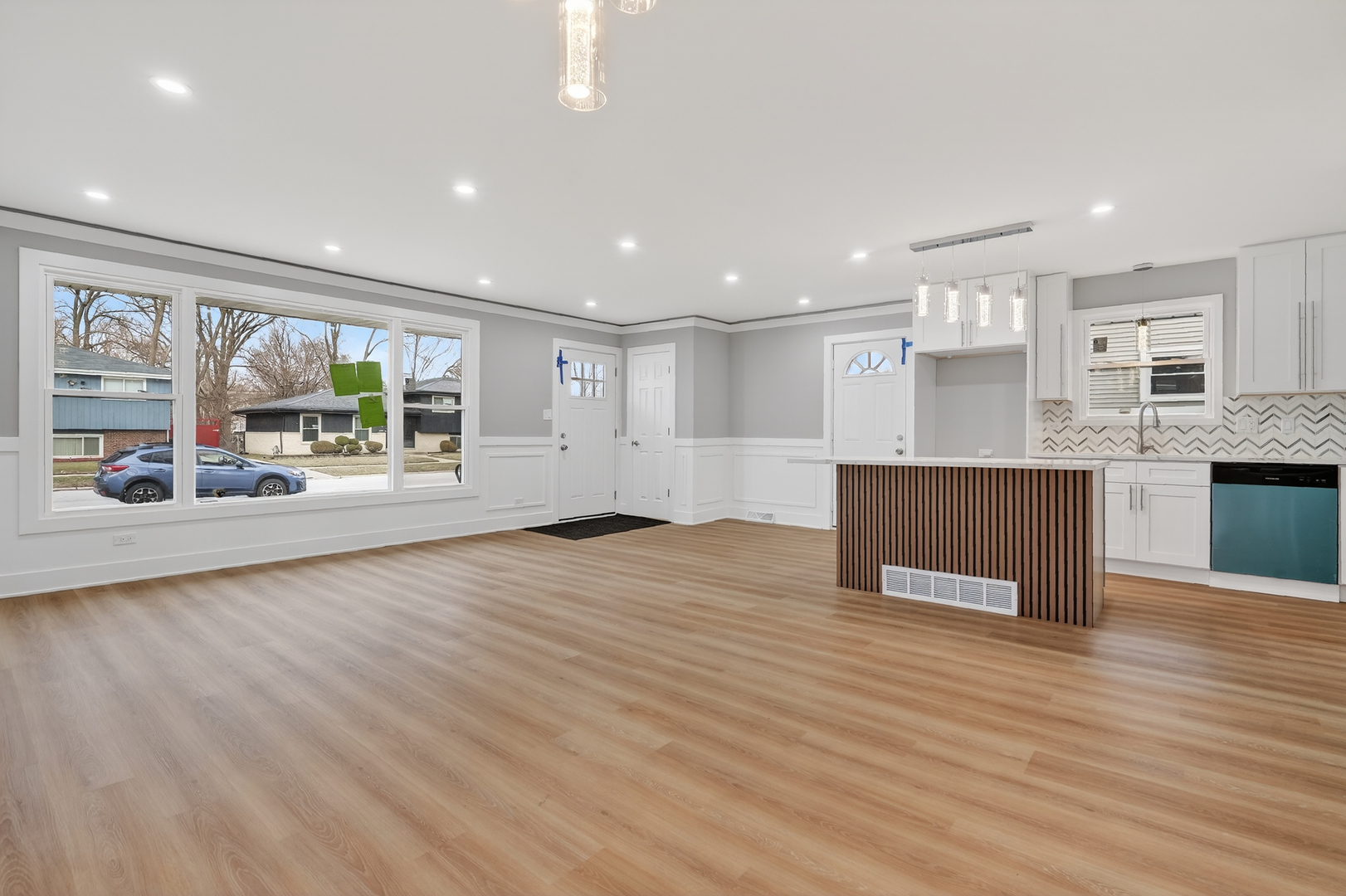 515 West 146th Street Dolton, IL 60419 - Photo 16 of 47 a view of a kitchen with kitchen island a window wooden floor and stainless steel appliances