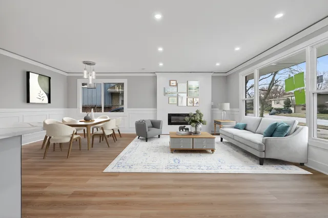 a living room with furniture dining table and a large window
