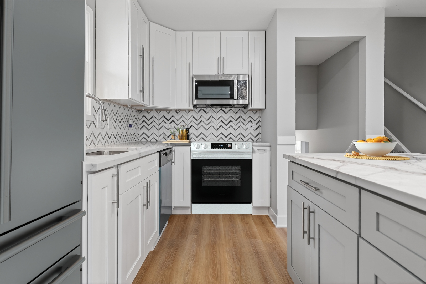 515 West 146th Street Dolton, IL 60419 - Photo 5 of 47 a kitchen with granite countertop white cabinets and stainless steel appliances