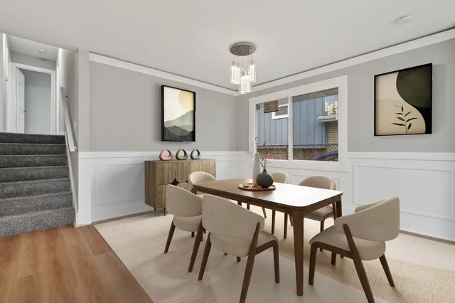 a view of a a dining room with furniture window and wooden floor