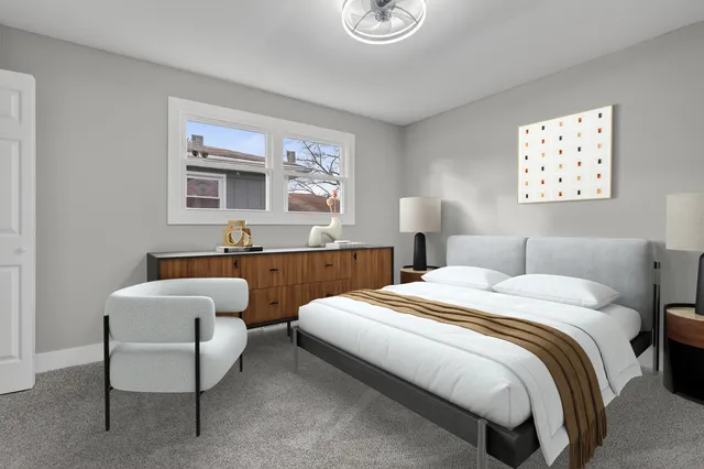 a bed room with a bed and a couch