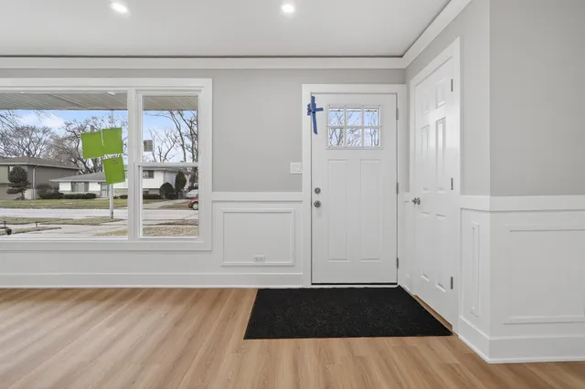 a view of front door and bedroom