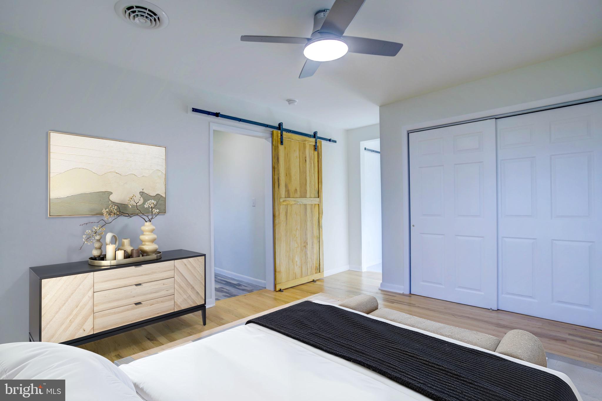 2229 Hudson Road Cambridge, MD 21613 - Photo 27 of 47 Modern bedroom with sliding barn door.