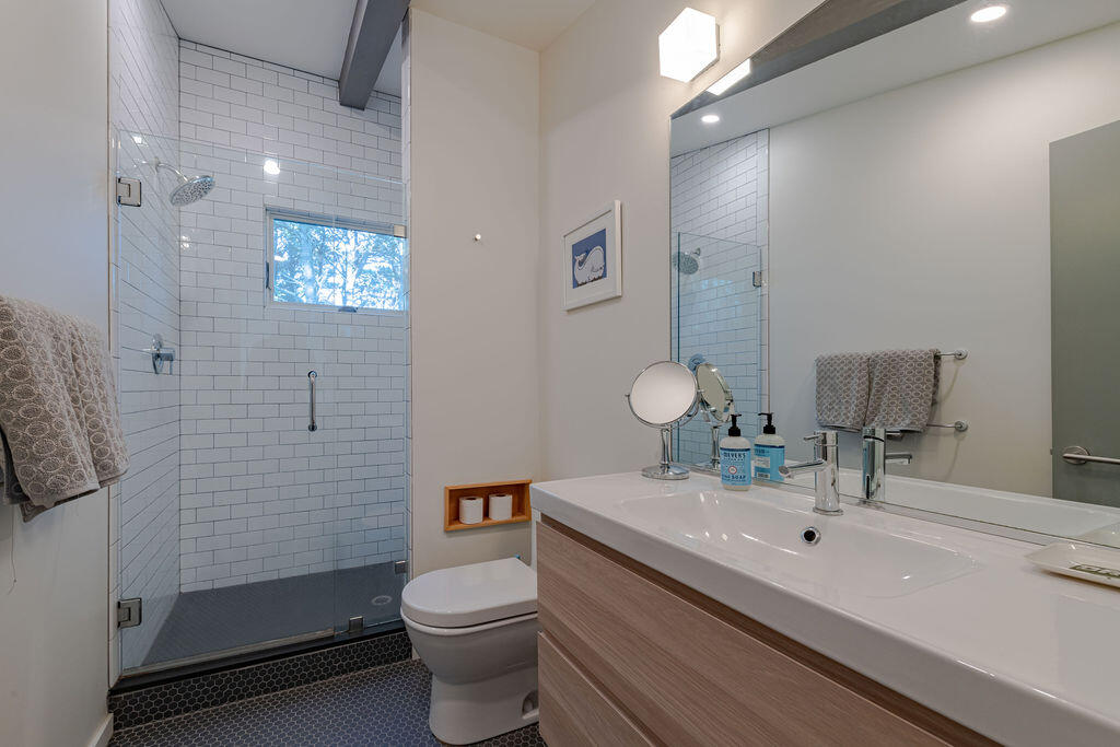 73 King Phillip Road Wellfleet, MA 02667 - Photo 19 of 35 a bathroom with a sink a toilet and shower