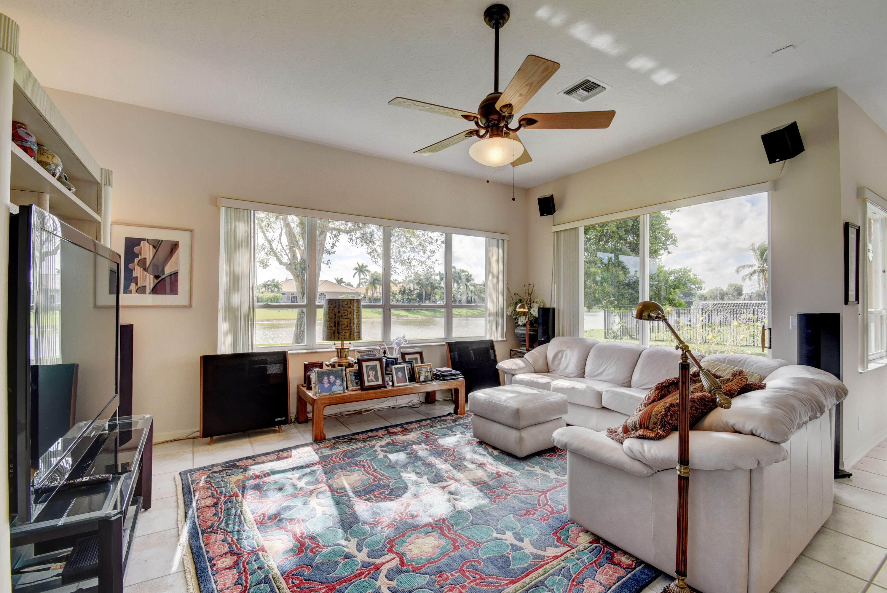 21587 Halstead Drive Boca Raton, FL 33428 - Photo 11 of 53 a living room with furniture large window and a flat screen tv