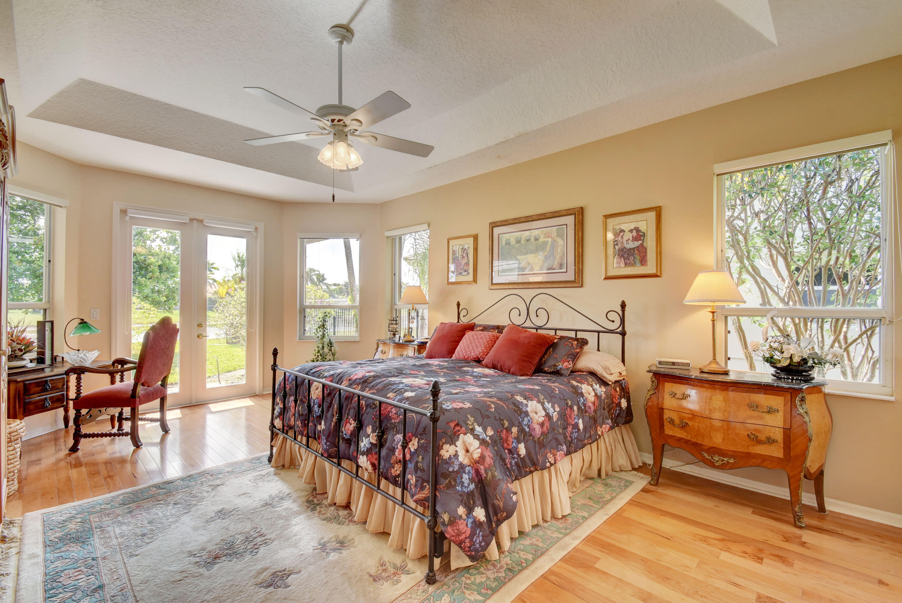 21587 Halstead Drive Boca Raton, FL 33428 - Photo 23 of 53 a bedroom with a bed and a chandelier