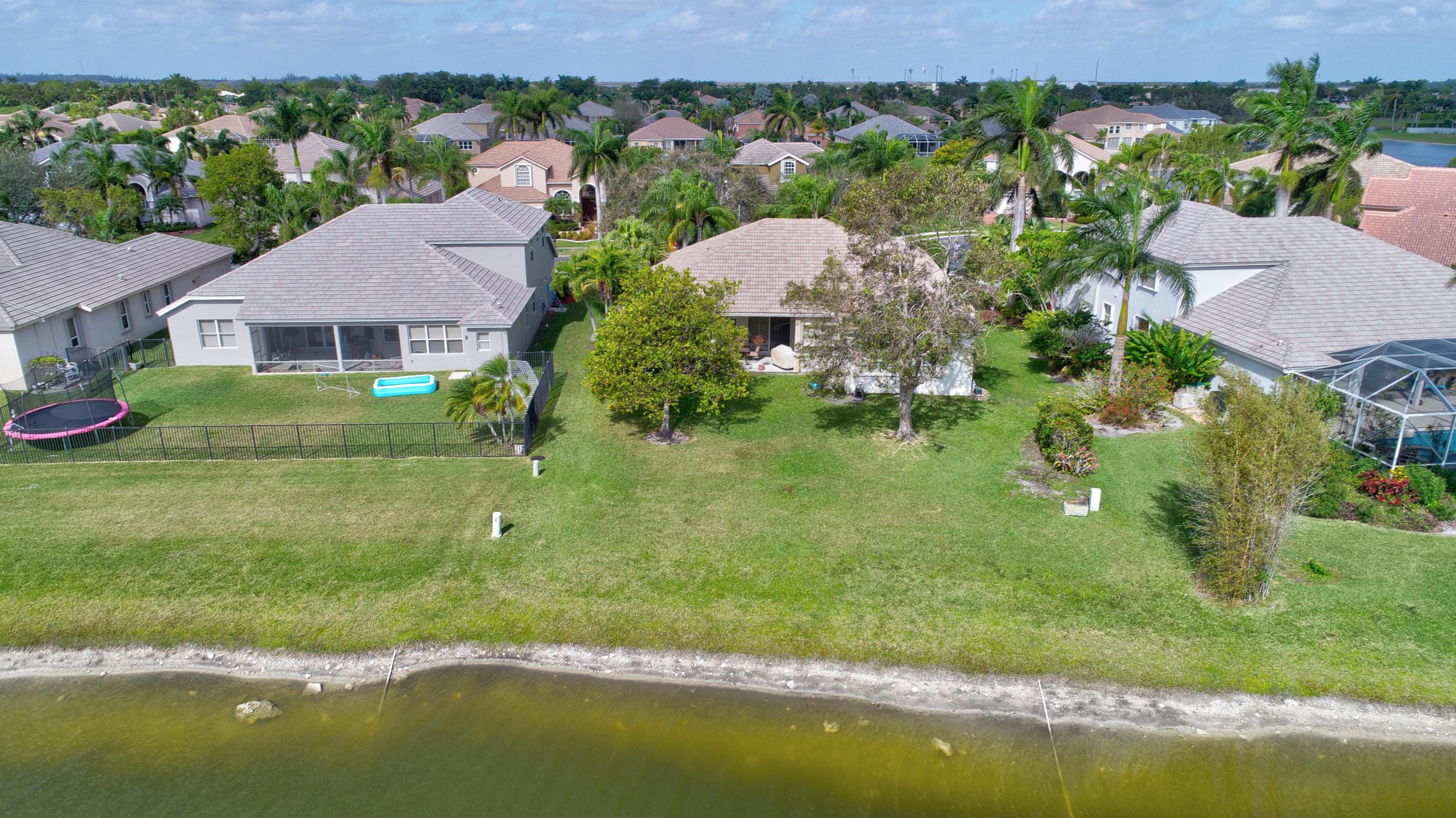 21587 Halstead Drive Boca Raton, FL 33428 - Photo 44 of 53 an aerial view of residential houses with outdoor space and trees