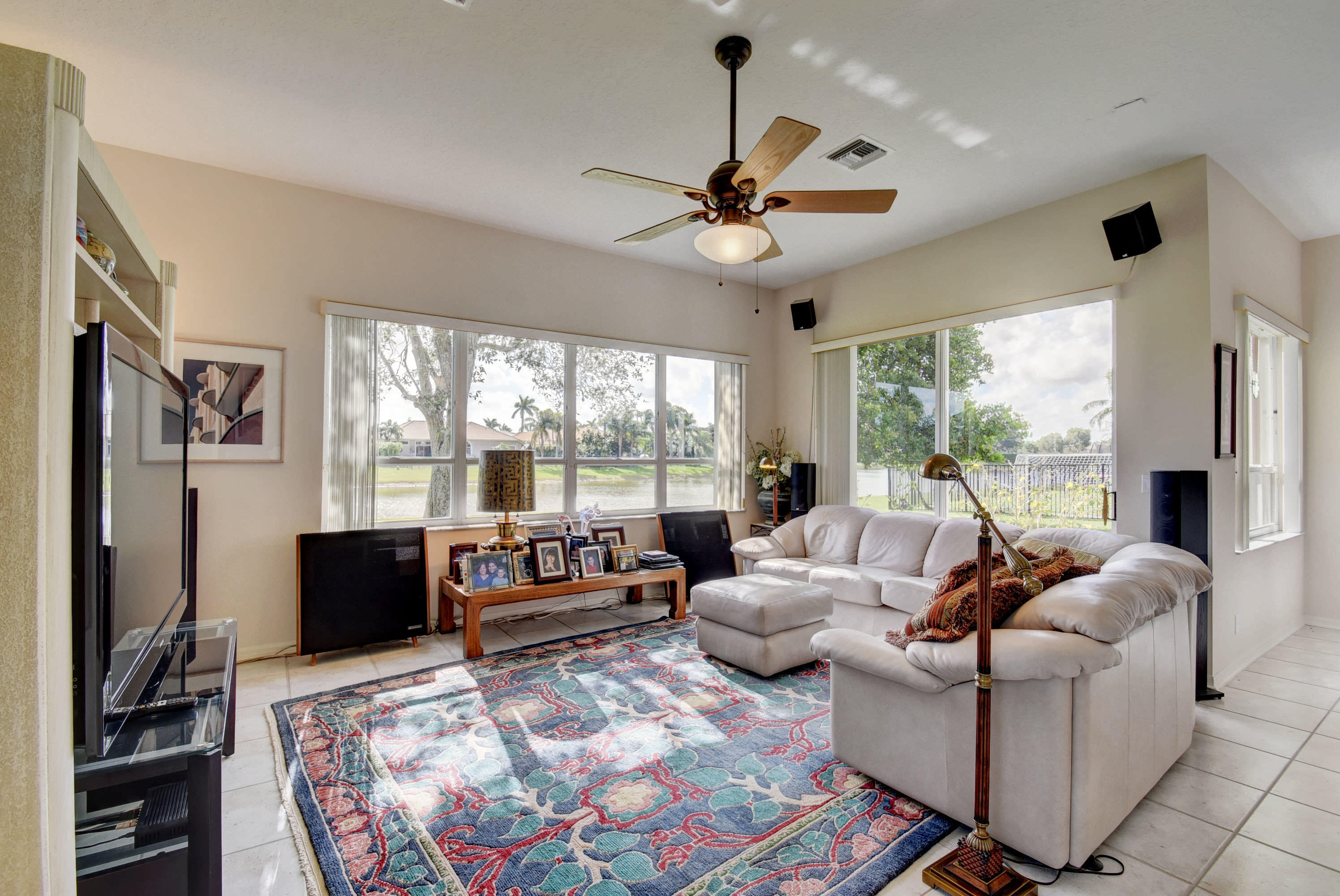 21587 Halstead Drive Boca Raton, FL 33428 - Photo 9 of 53 a living room with furniture large window and a flat screen tv