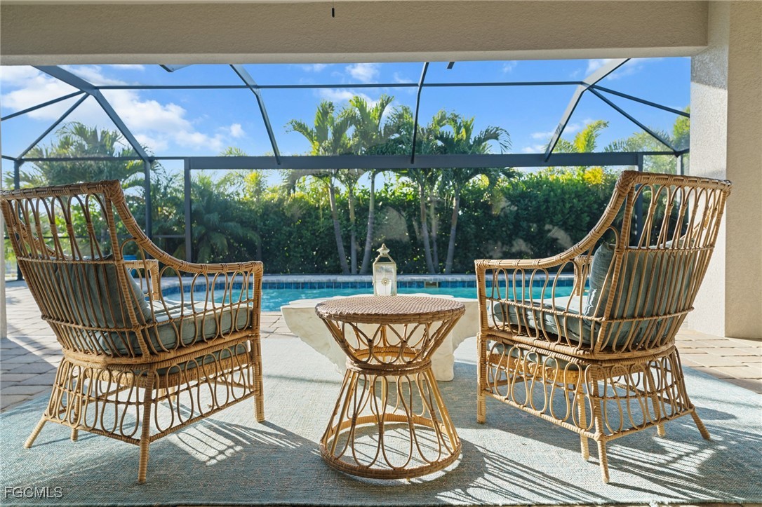 a view of a chairs and table in the balcony
