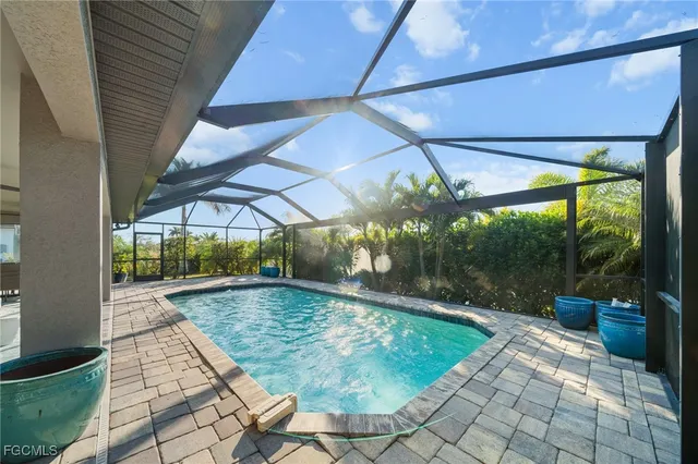 a view of a dining room with furniture and a chandelier