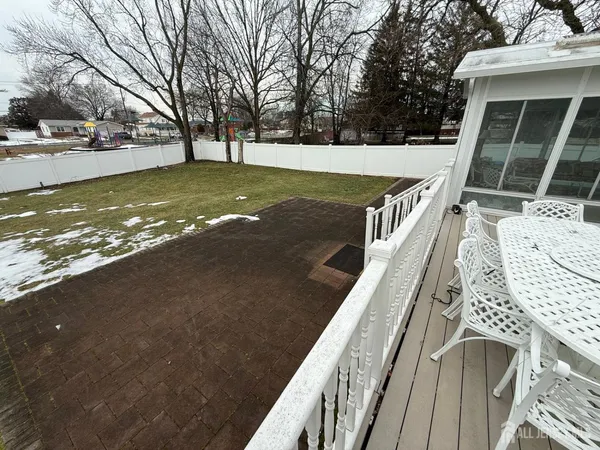 a view of a swimming pool with a patio