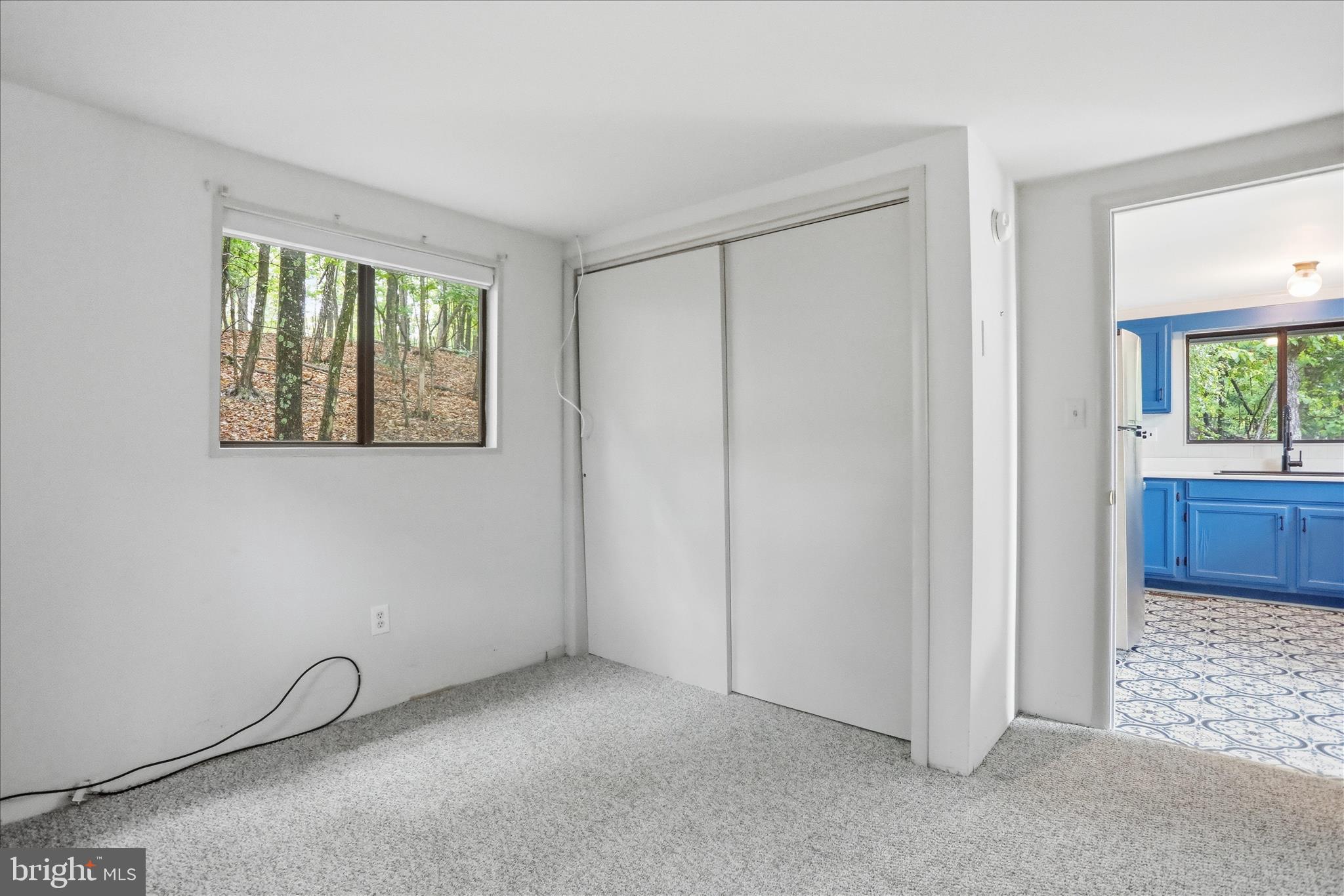 578 Walden Road Hedgesville, WV 25427 - Photo 13 of 39 a view of an empty room with a window