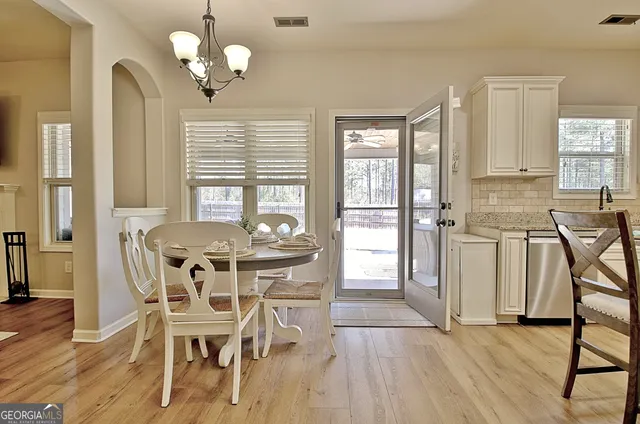 a view of a livingroom with furniture and wooden floor