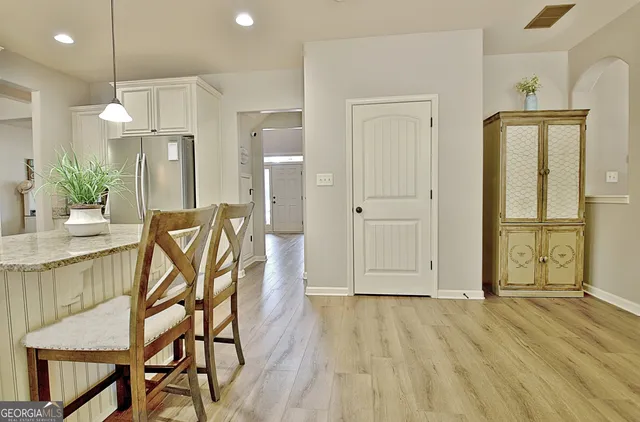 a living room with fireplace furniture and a flat screen tv