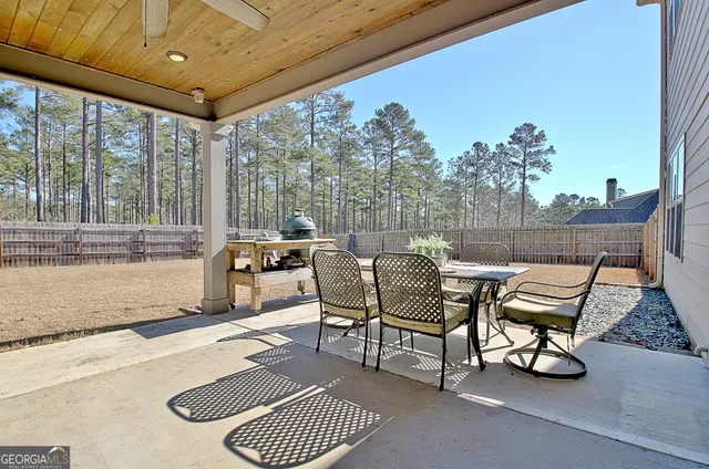 a view of a hallway with wooden floor and stairs