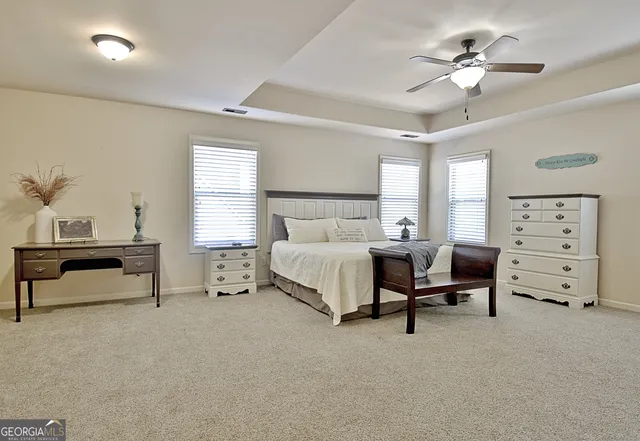 a spacious bathroom with a double vanity sink and a mirror