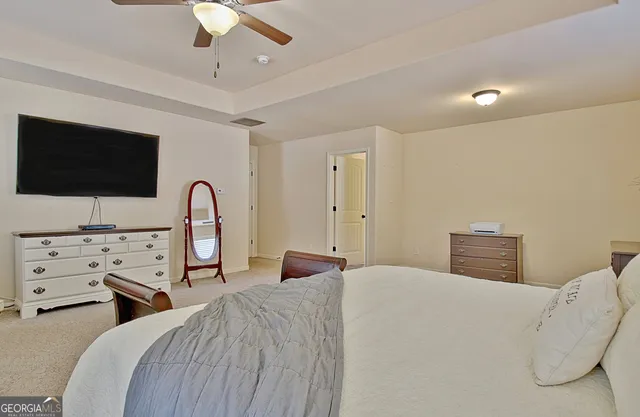 a bathroom with a shower a sink and a mirror