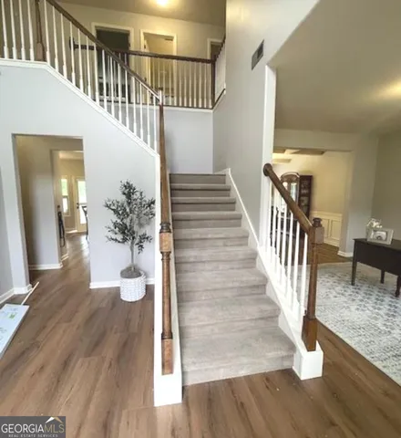 a view of an entryway with wooden floor