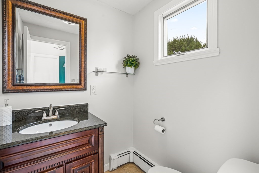 3 Laird Road Medford, MA 02155 - Photo 20 of 42 a bathroom with a sink and a mirror