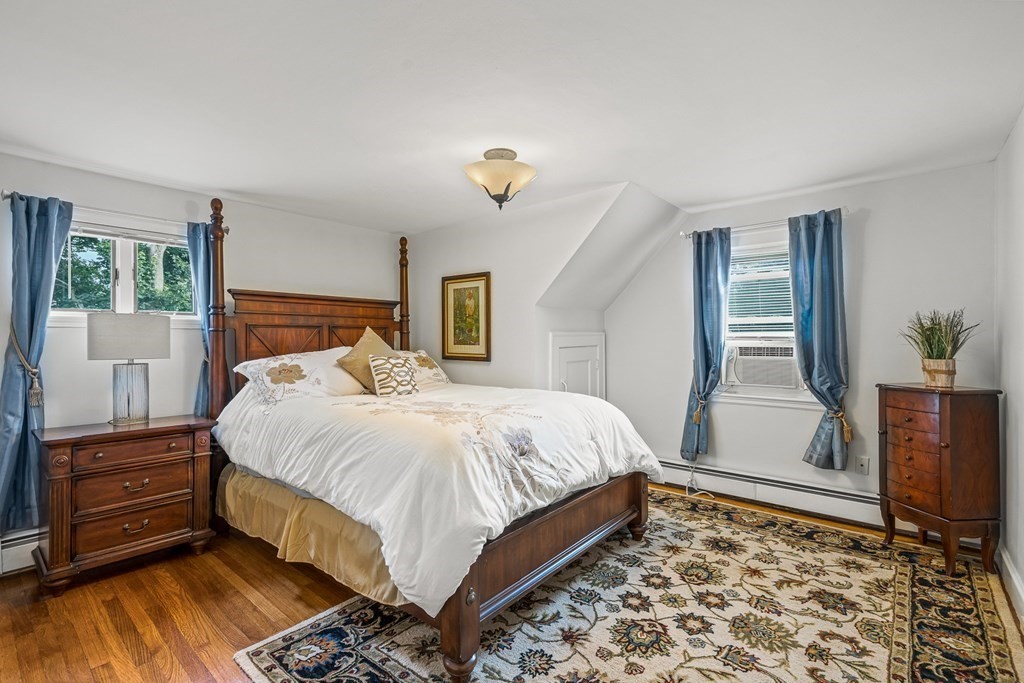 3 Laird Road Medford, MA 02155 - Photo 22 of 42 a bedroom with a bed and a window