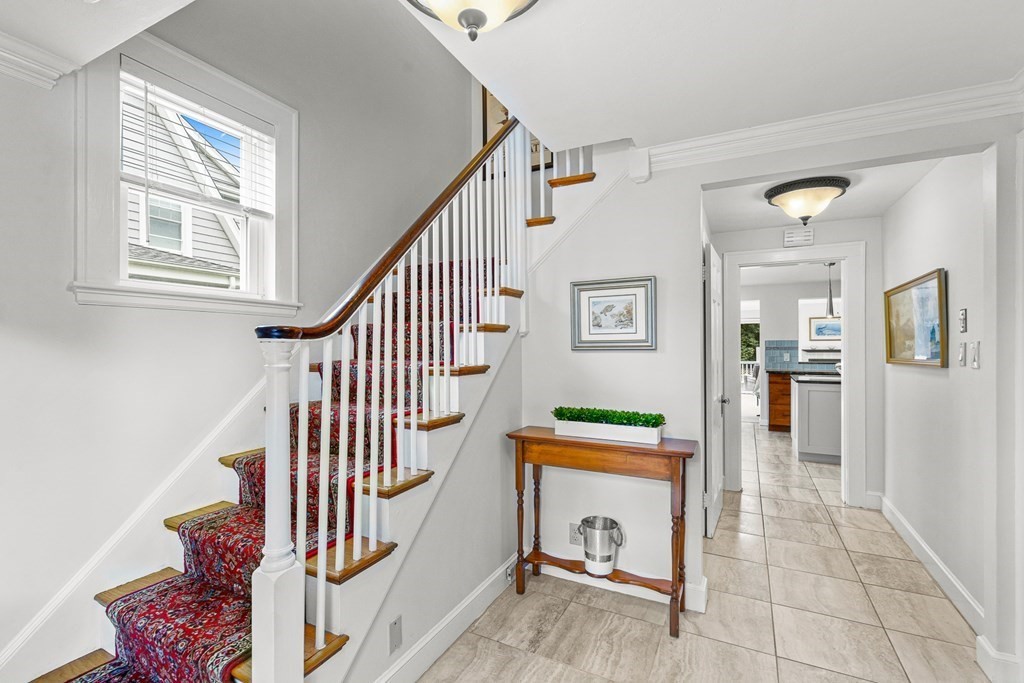 3 Laird Road Medford, MA 02155 - Photo 4 of 42 a view of an entryway with wooden floor and a livingroom view