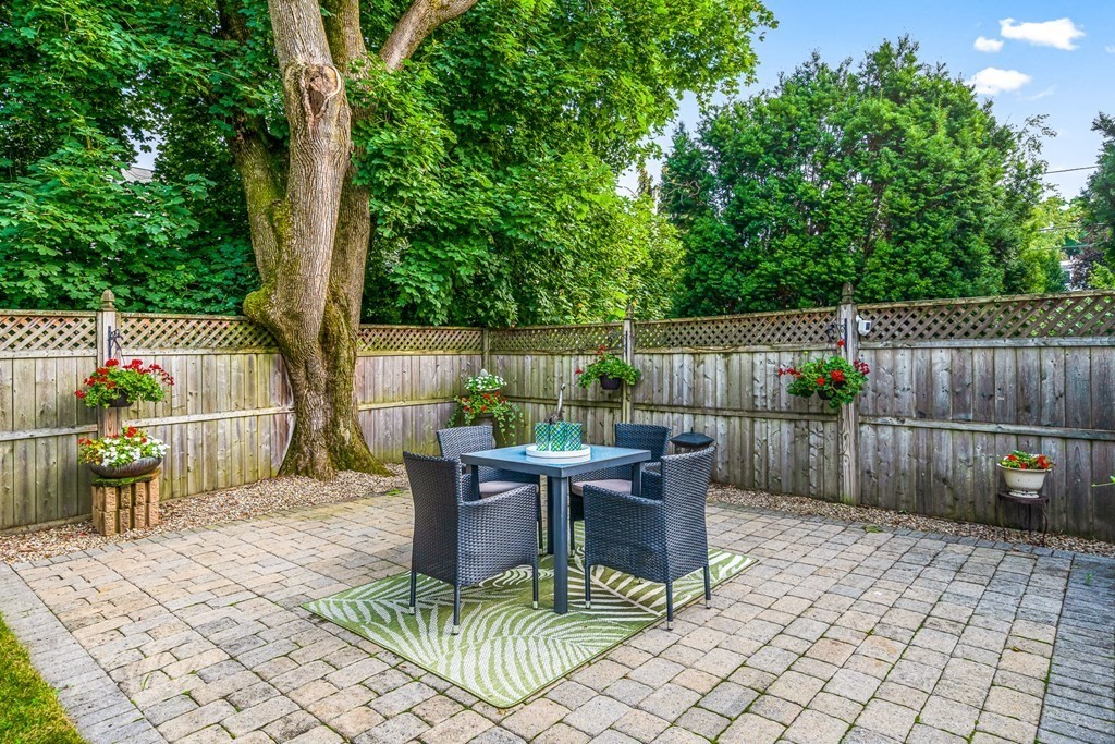 3 Laird Road Medford, MA 02155 - Photo 41 of 42 a view of a patio with a dining table and chairs