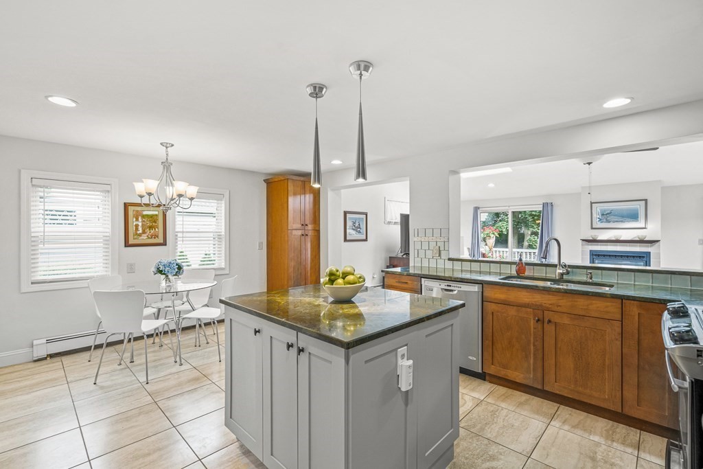 3 Laird Road Medford, MA 02155 - Photo 10 of 42 a kitchen with granite countertop sink stove and cabinets