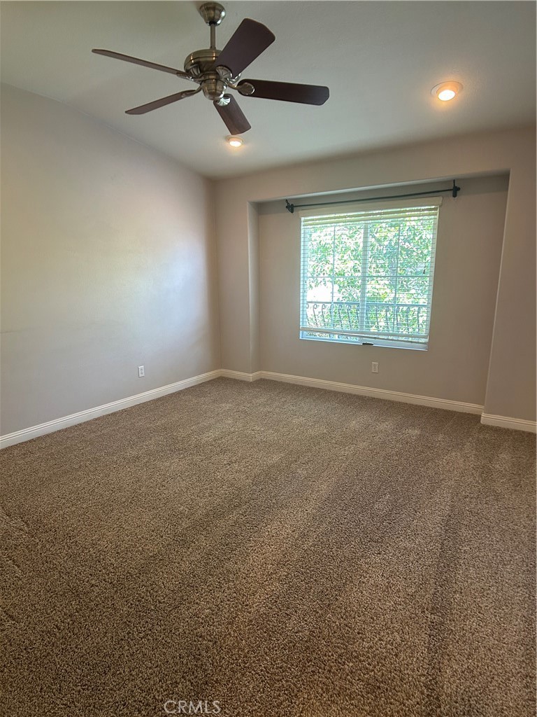 23 Cameron, Unit 67 Irvine, CA 92602 - Photo 11 of 15 a view of room with a ceiling fan and window
