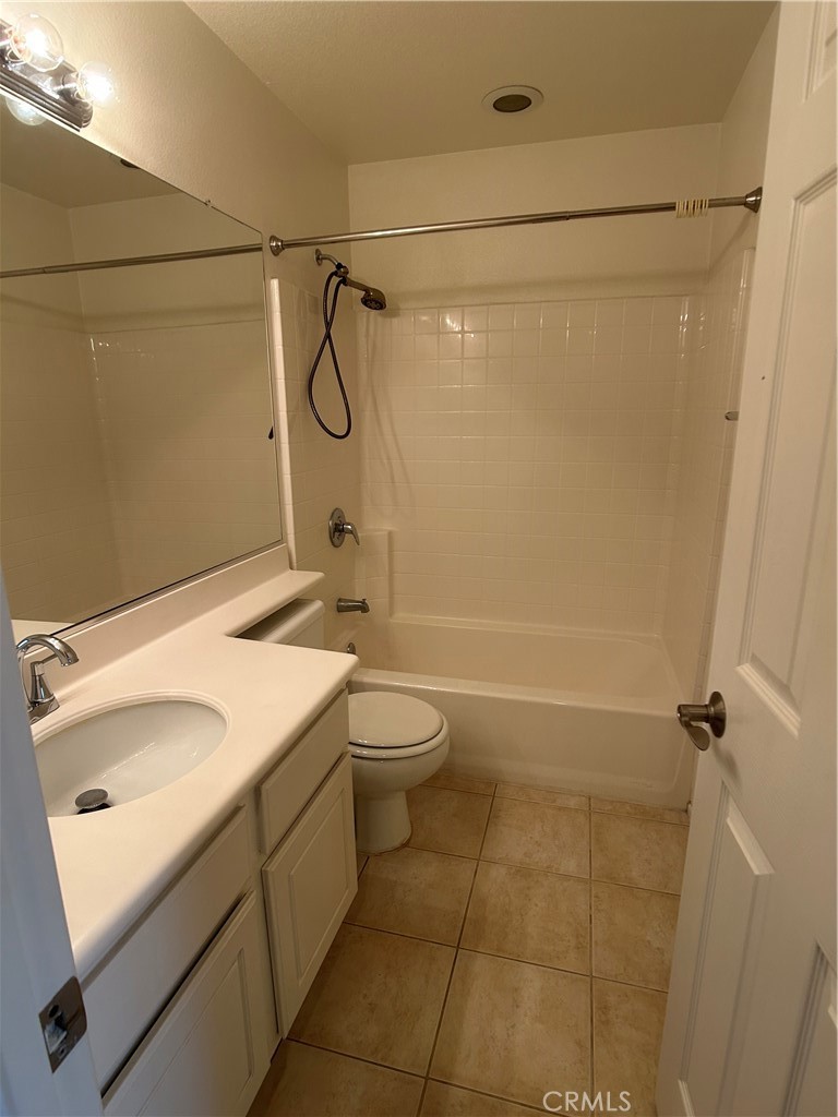 23 Cameron, Unit 67 Irvine, CA 92602 - Photo 10 of 15 a bathroom with a granite countertop sink a toilet and shower