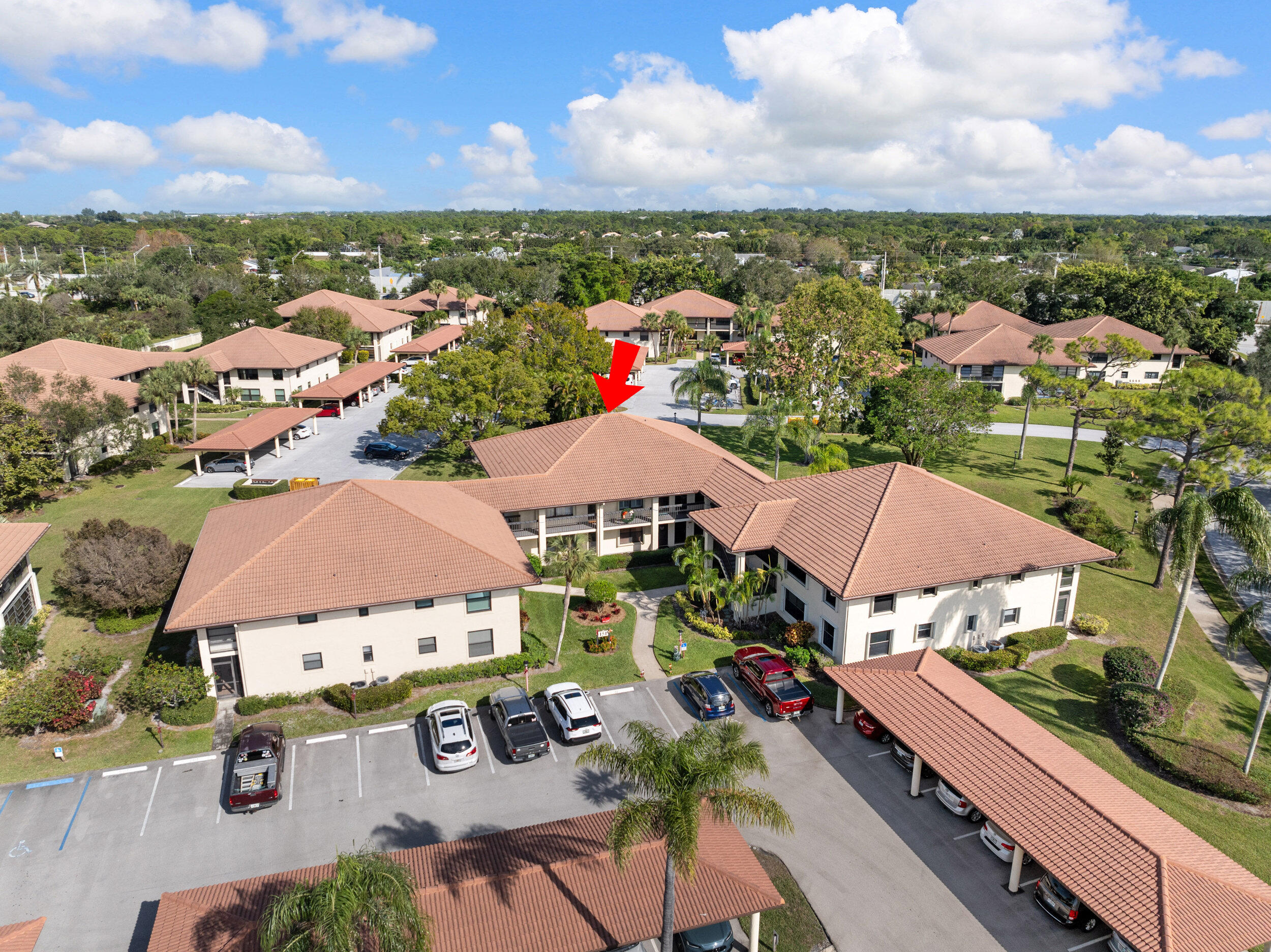 151 Southwest South River Drive, Unit 203 Stuart, FL 34997 - Photo 1 of 54 an aerial view of residential houses and outdoor space