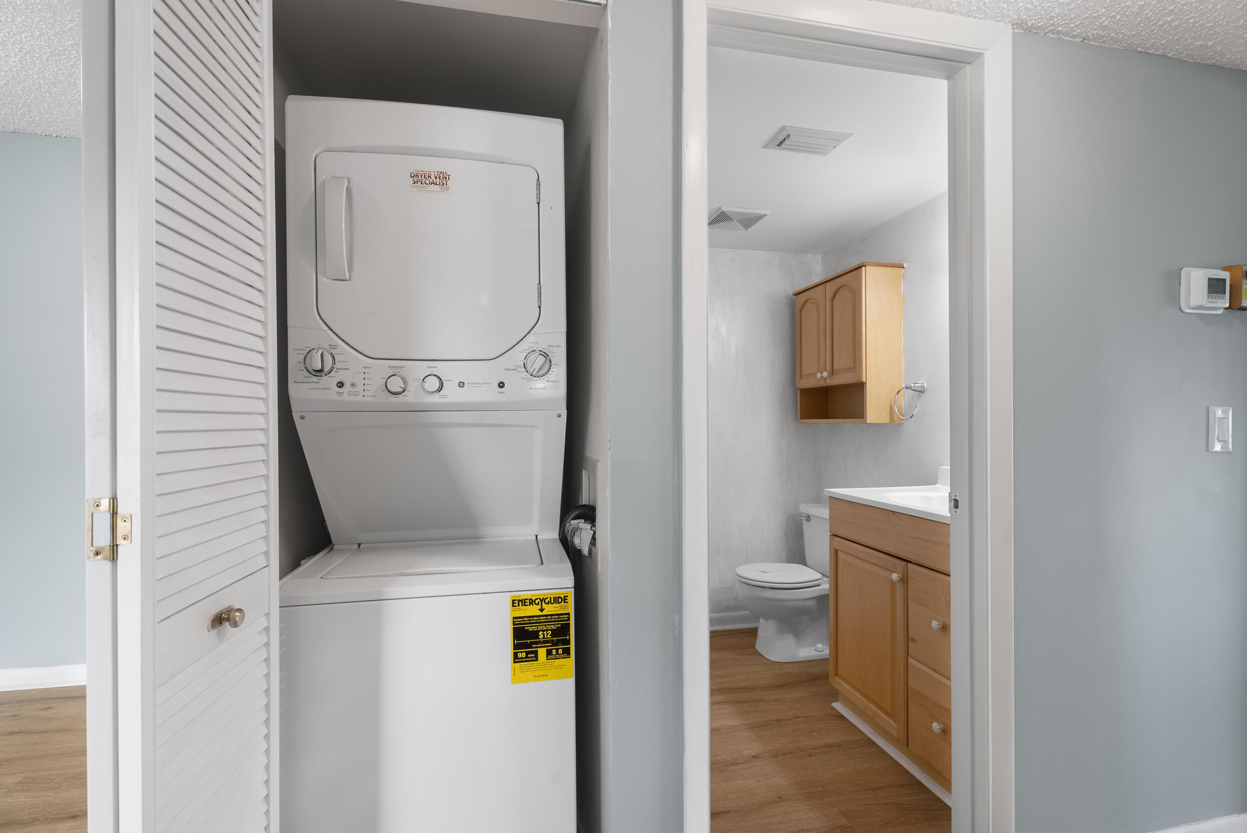 151 Southwest South River Drive, Unit 203 Stuart, FL 34997 - Photo 14 of 54 a bathroom with a toilet and a sink