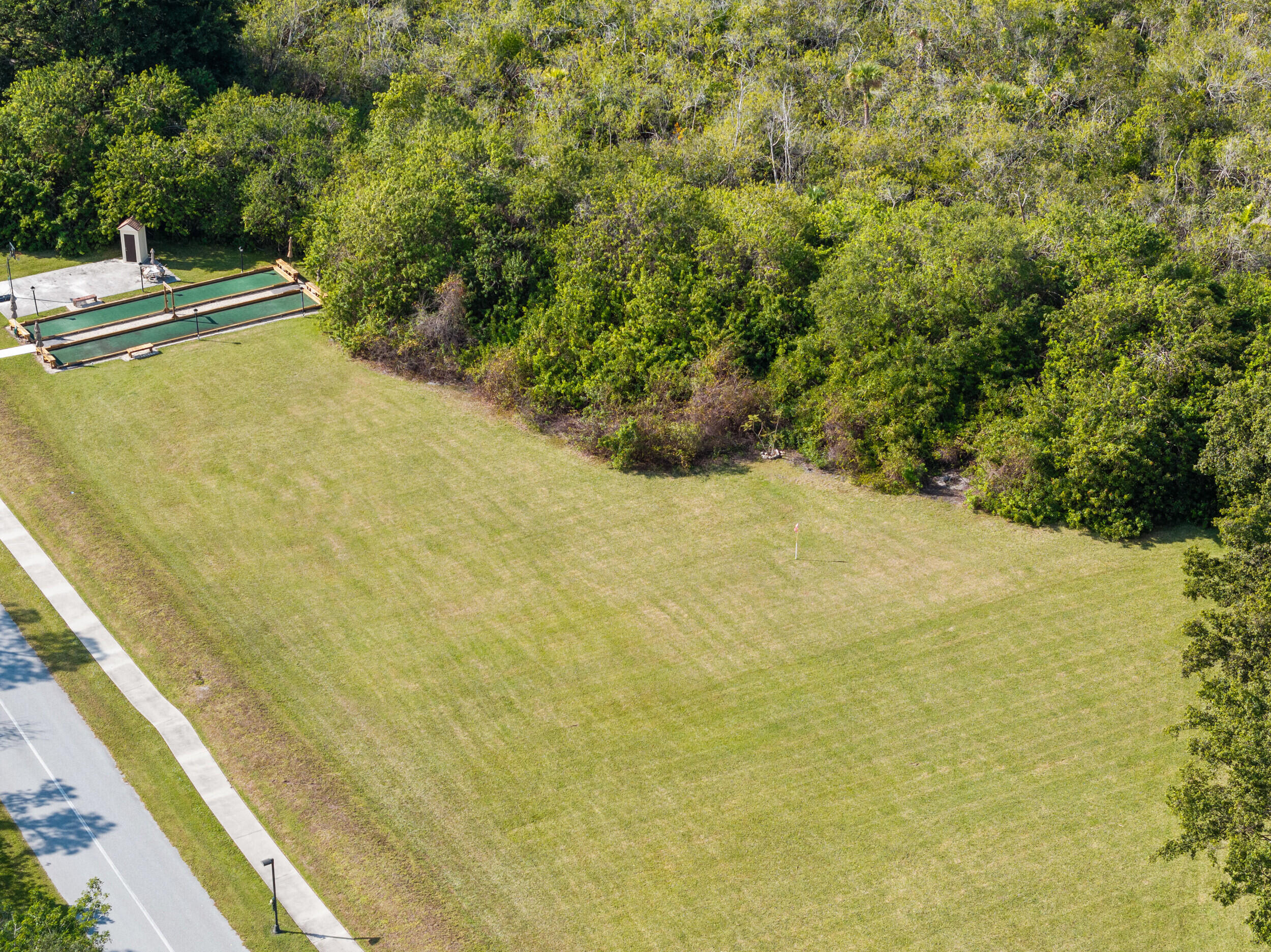 151 Southwest South River Drive, Unit 203 Stuart, FL 34997 - Photo 26 of 54 a view of a yard with an outdoor space
