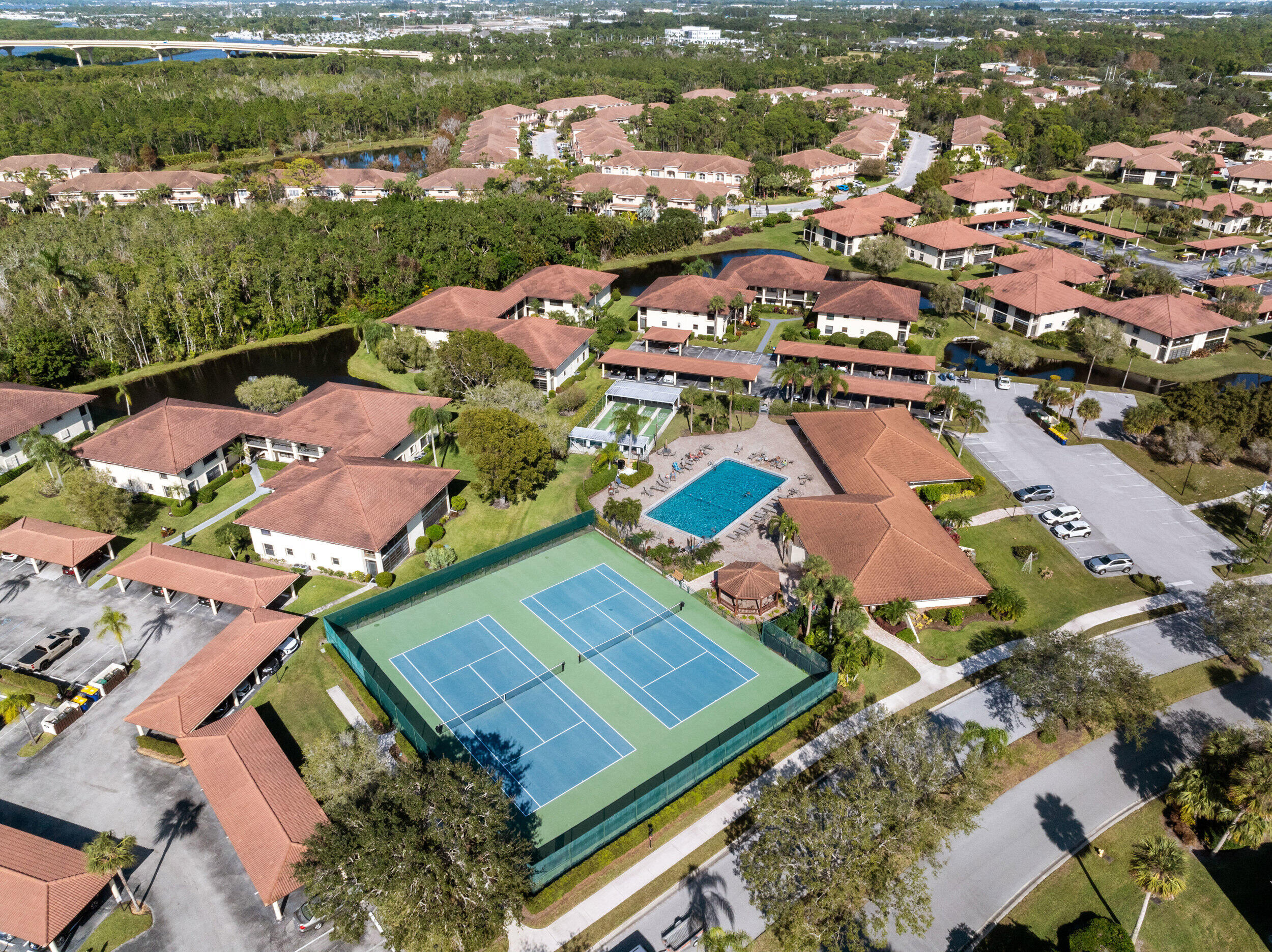 151 Southwest South River Drive, Unit 203 Stuart, FL 34997 - Photo 27 of 54 an aerial view of a city with lots of residential buildings lake and ocean view