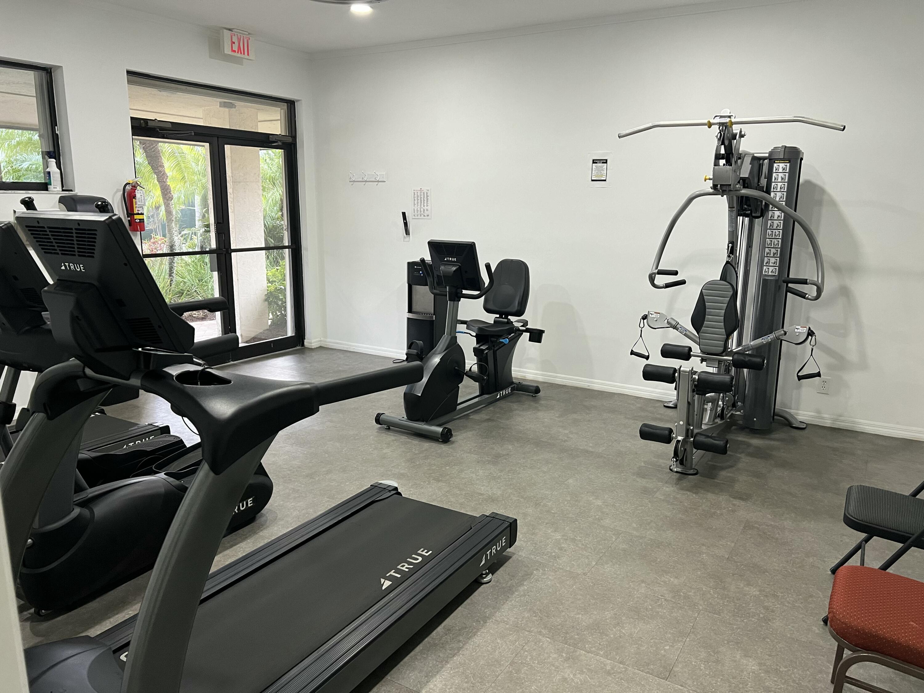 151 Southwest South River Drive, Unit 203 Stuart, FL 34997 - Photo 36 of 54 a view of a room with gym equipment