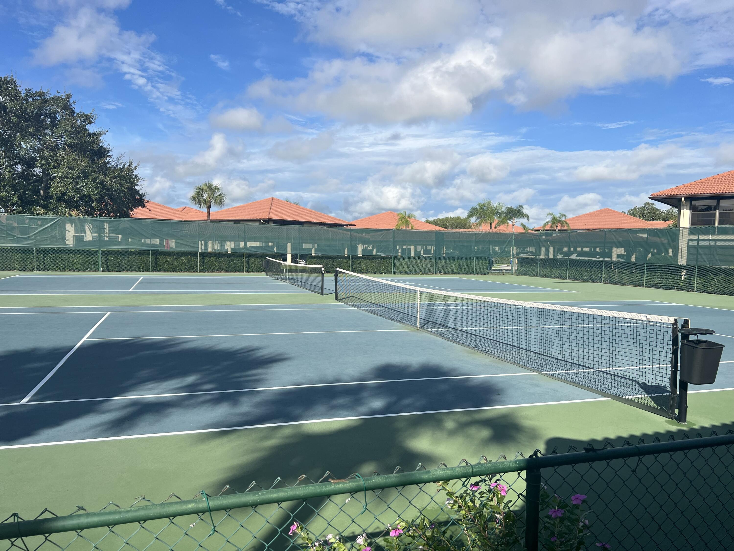 151 Southwest South River Drive, Unit 203 Stuart, FL 34997 - Photo 46 of 54 a view of a tennis court