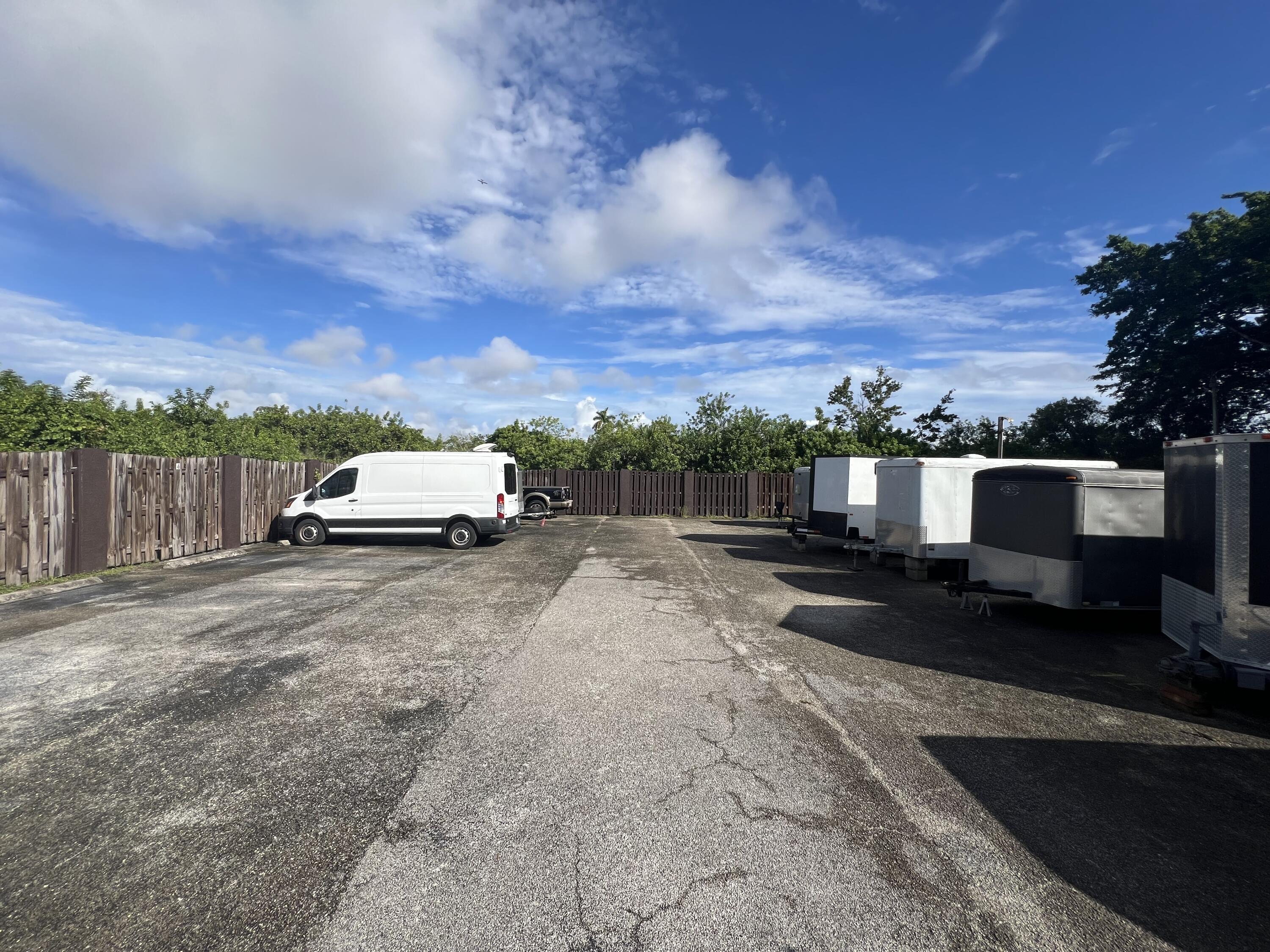 151 Southwest South River Drive, Unit 203 Stuart, FL 34997 - Photo 52 of 54 a car parked on the side of the road