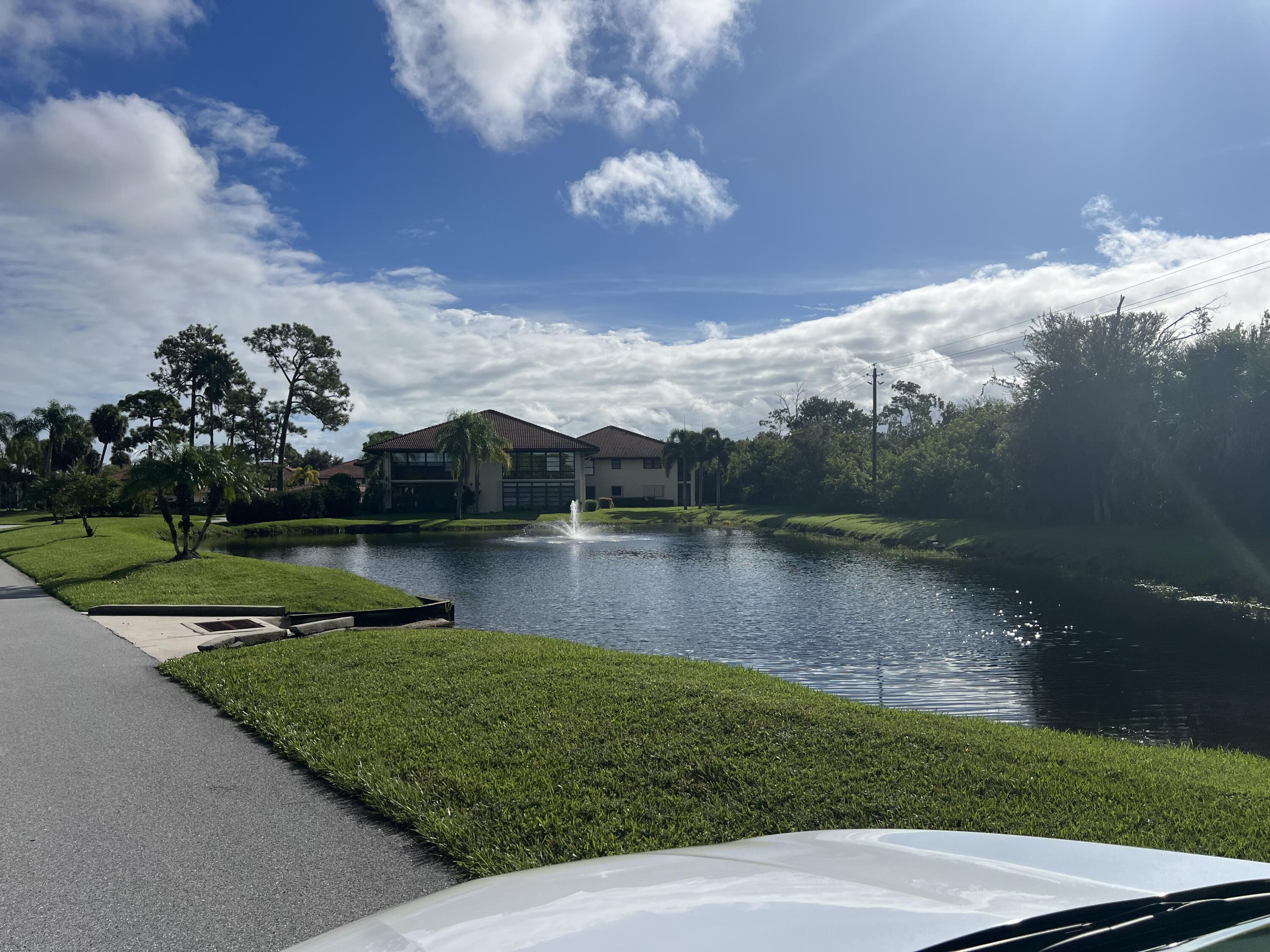 151 Southwest South River Drive, Unit 203 Stuart, FL 34997 - Photo 53 of 54 a view of a lake from a yard