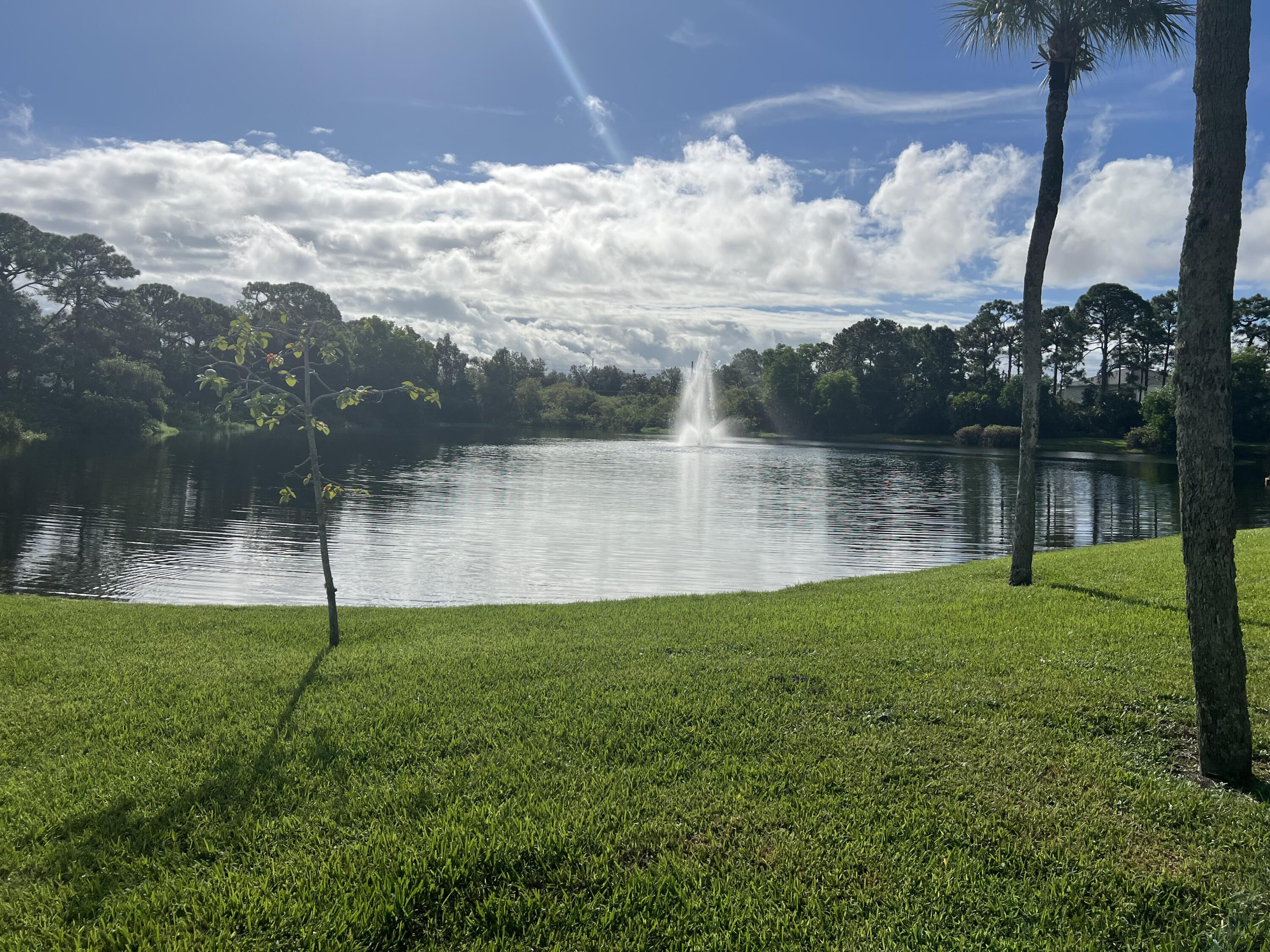151 Southwest South River Drive, Unit 203 Stuart, FL 34997 - Photo 54 of 54 a view of a lake with a big yard