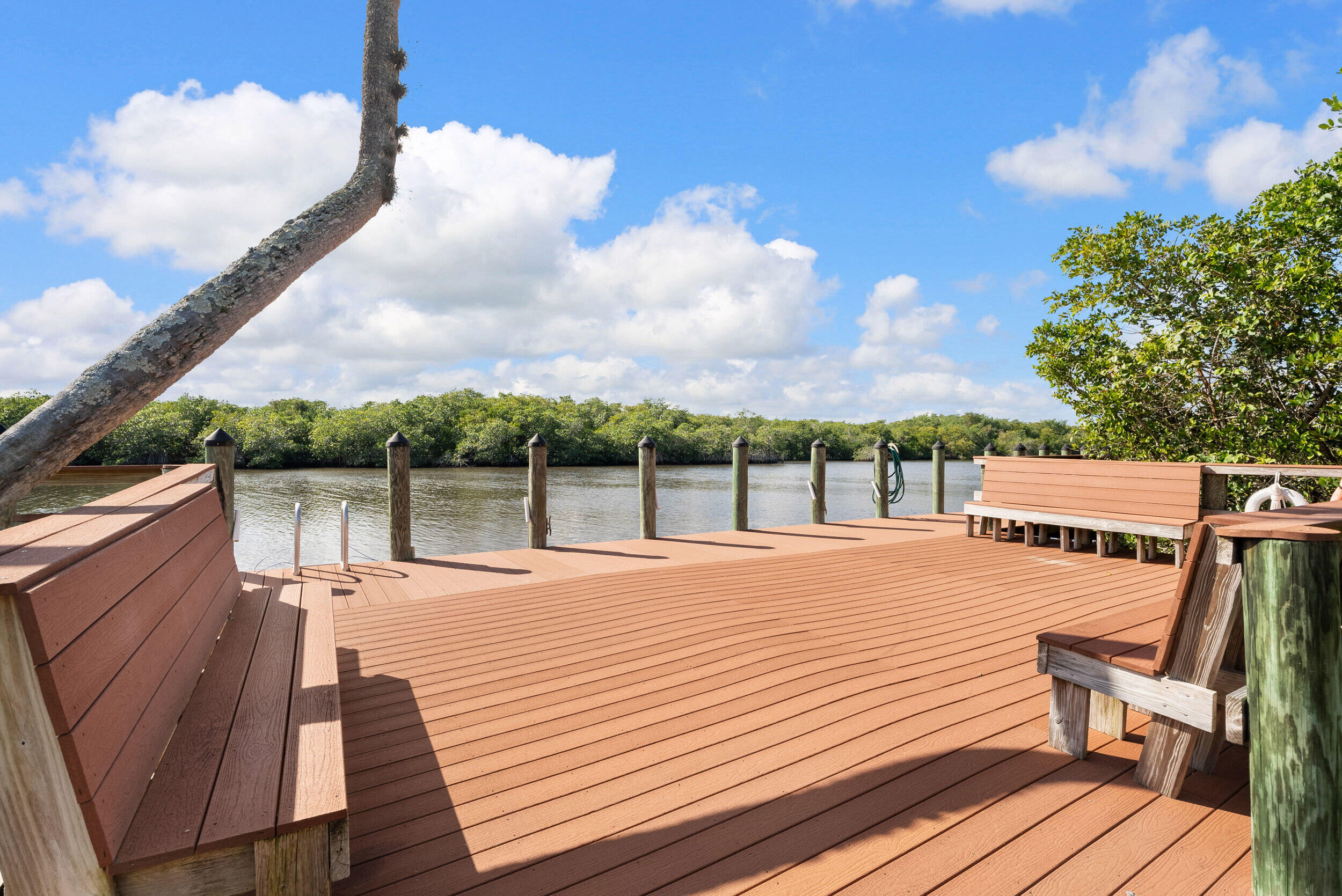 151 Southwest South River Drive, Unit 203 Stuart, FL 34997 - Photo 6 of 54 a view of a balcony with wooden floor and fence