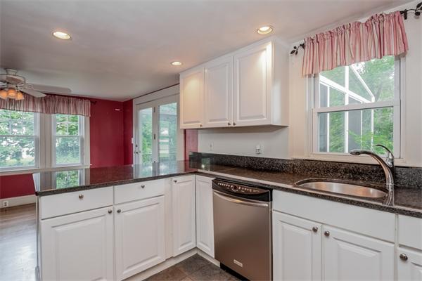 15 Volusia Road Hingham, MA 02043 - Photo 8 of 22 a kitchen with granite countertop white cabinets and a window