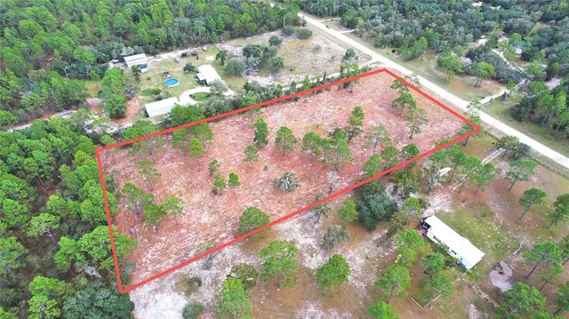 a view of swimming pool with a yard