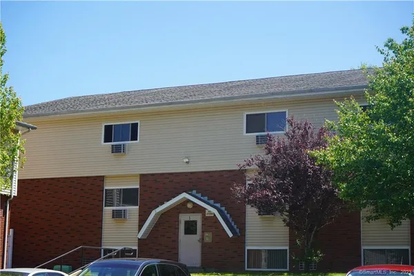 a front view of a house with yard